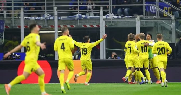 Para pemain Bodo/Glimt merayakan kemenangan usai mengalahkan Inter Milan 2-1 (agregat 5-2) pada leg kedua playoff babak 16 besar Liga Champions di Stadion Giuseppe Meazza, Milan, Rabu (25/2/2026).